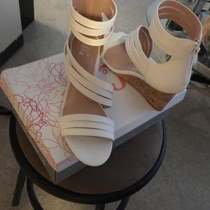 Wedged heel high ankle back zip sandals.